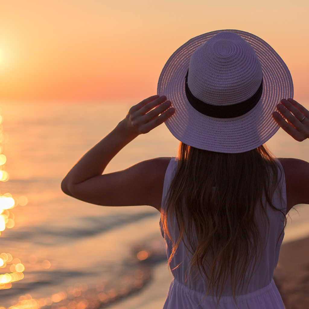 woman looking at sunset on a solo date