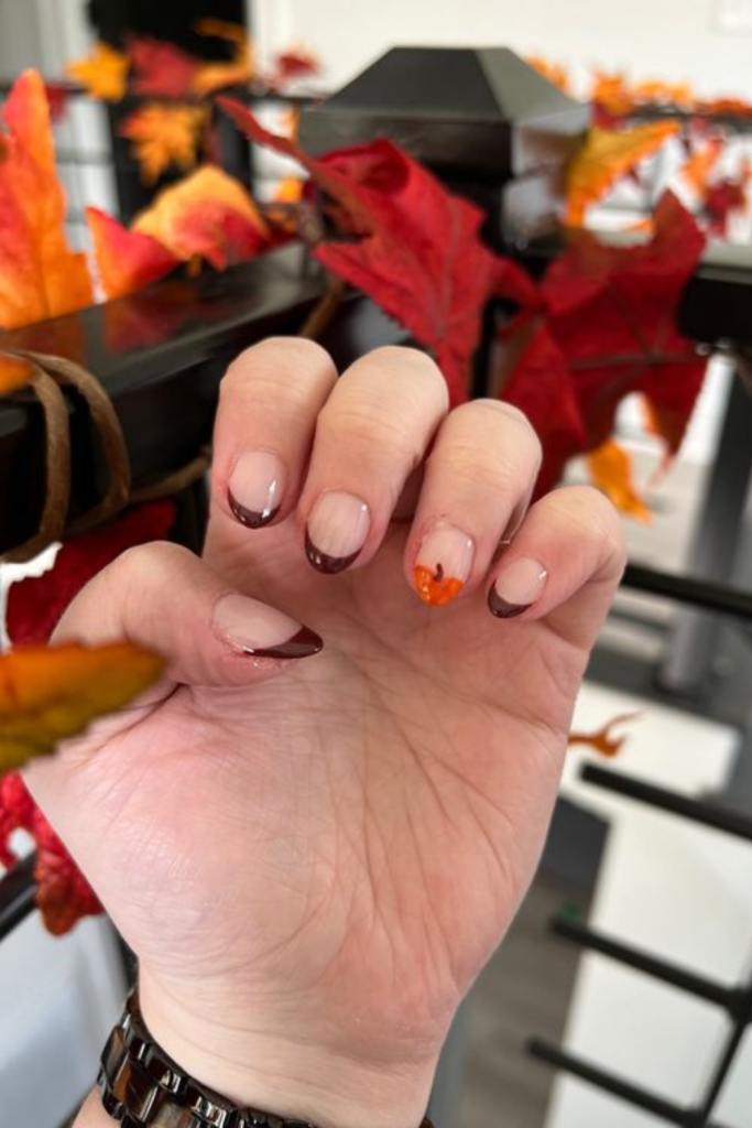 Halloween nail design with pumpkins