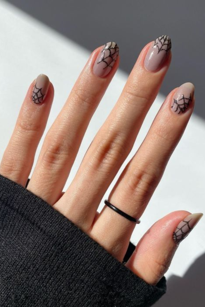 Halloween nails using spider webs