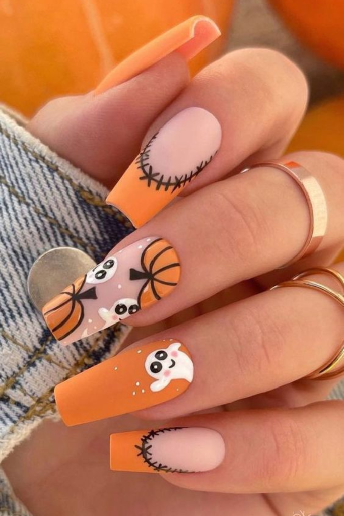 Halloween nail design with pumpkins