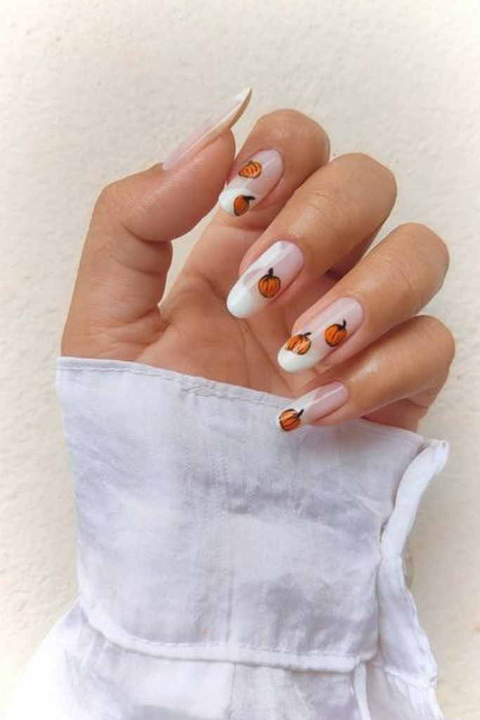 Halloween nail design with pumpkins