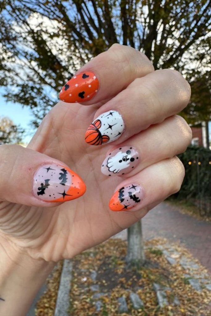 Halloween nail design with pumpkins