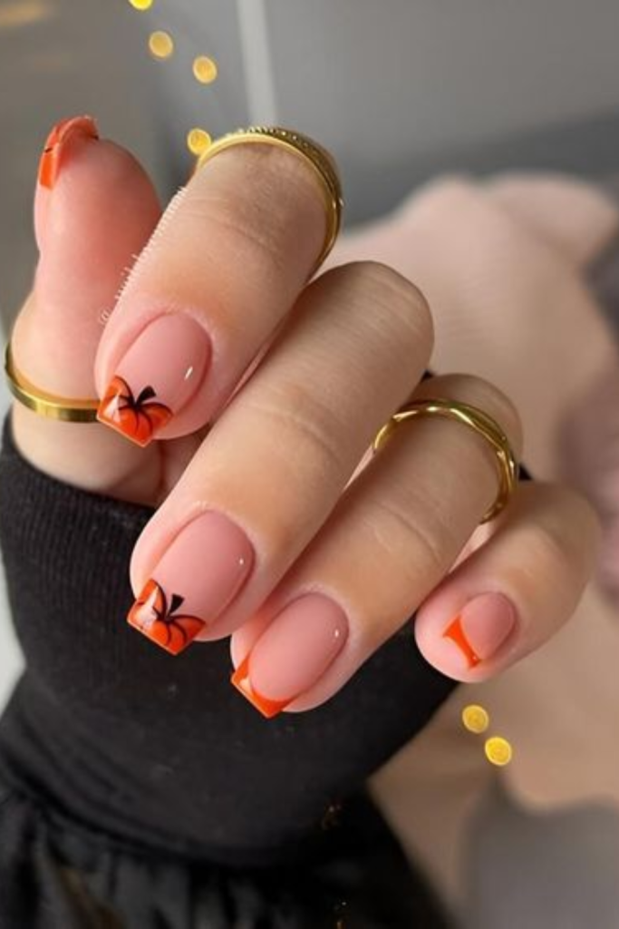 Halloween nail design with pumpkins