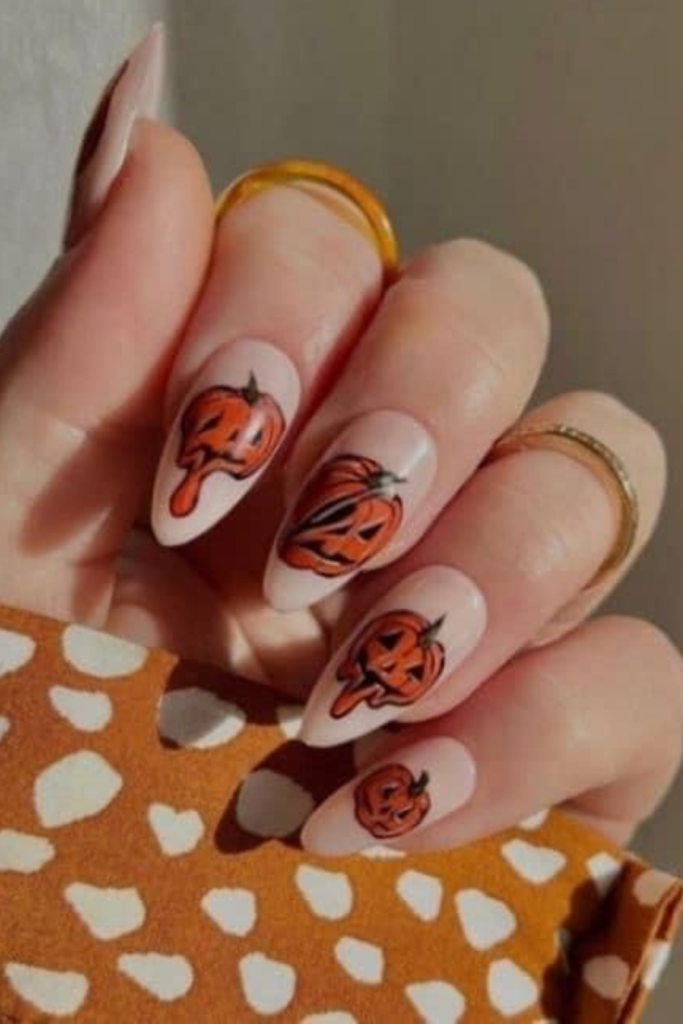 Halloween nail design with pumpkins